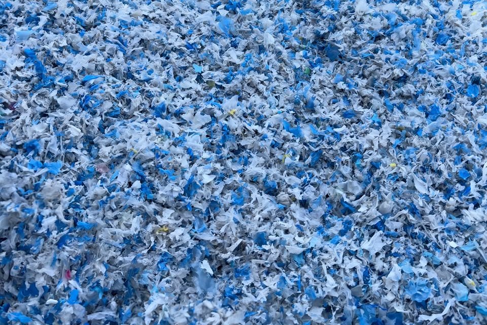 Large stock of blue and white recycled plastic flakes
