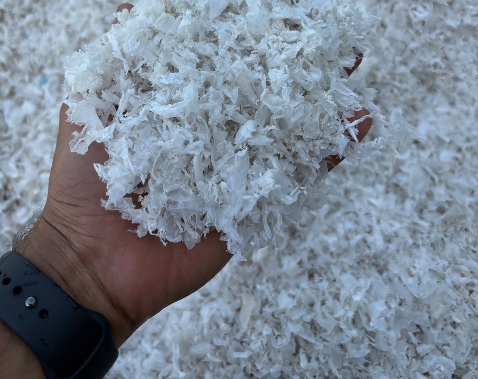 Recycled LDPE plastic flakes held in hand